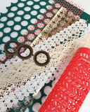 Collection of various textured ribbons and decorative tapes on a white background